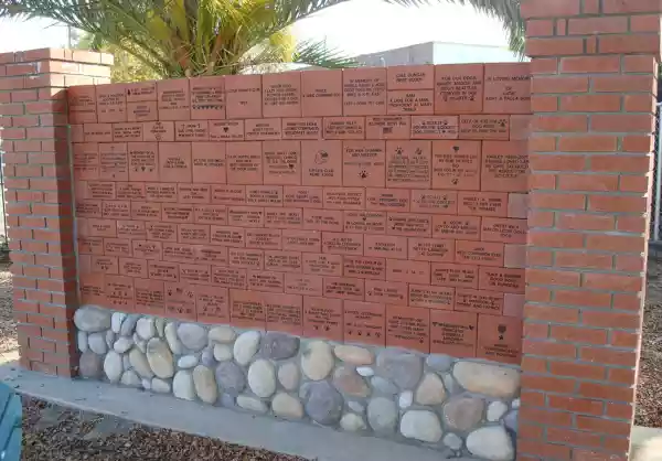 Brick wall with engraved bricks